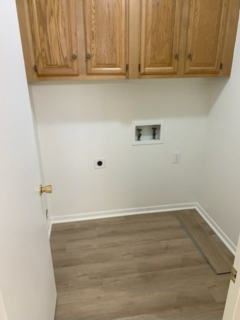 304 Lakeview St, Whitehouse, TX 75791 - washroom featuring washer hookup, wood finished floors, hookup for an electric dryer, and cabinet space