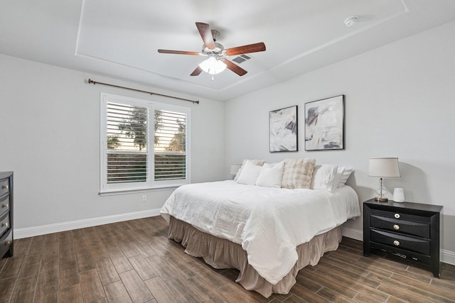 3804 Driftwood Ln, Northlake, TX 76226 - bedroom with dark wood-style floors, a ceiling fan, and a tray ceiling