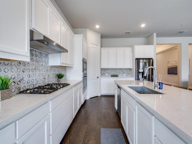 2112 Deer Run, Gunter, TX 75058 - kitchen featuring appliances with stainless steel finishes, under cabinet range hood, white cabinets, dark wood finished floors, and recessed lighting