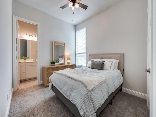 2112 Deer Run, Gunter, TX 75058 - bedroom featuring light carpet, connected bathroom, and ceiling fan