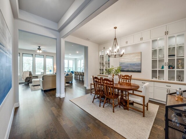 2112 Deer Run, Gunter, TX 75058 - dining room with dark wood finished floors, a chandelier, and ceiling fan