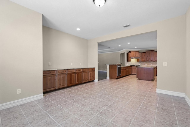 6371 Walnut Hill Ct, Frisco, TX 75036 - kitchen featuring recessed lighting, brown cabinets, decorative backsplash, dishwasher, and light tile patterned floors