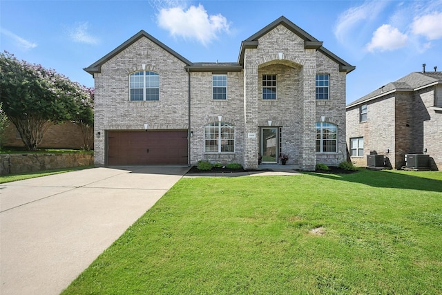 1906 Walnut Hills Ln, Mansfield, TX 76063 - view of front of home featuring an attached garage, driveway, a front yard, and brick siding
