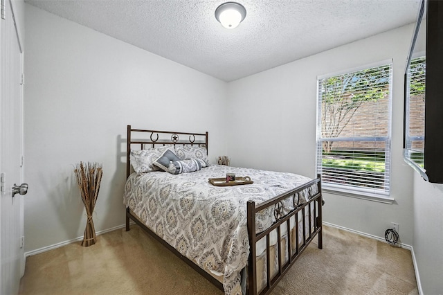 1906 Walnut Hills Ln, Mansfield, TX 76063 - carpeted bedroom featuring a textured ceiling and baseboards