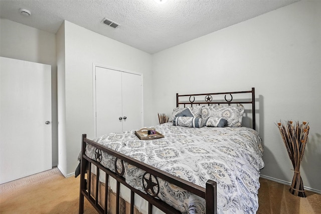 1906 Walnut Hills Ln, Mansfield, TX 76063 - bedroom with carpet flooring, a closet, and a textured ceiling
