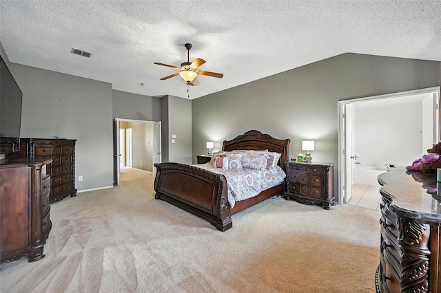 1906 Walnut Hills Ln, Mansfield, TX 76063 - bedroom featuring light carpet, lofted ceiling, ceiling fan, a textured ceiling, and ensuite bathroom