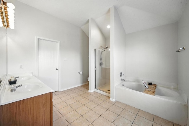 1906 Walnut Hills Ln, Mansfield, TX 76063 - bathroom featuring tile patterned flooring, a garden tub, double vanity, a stall shower, and vaulted ceiling