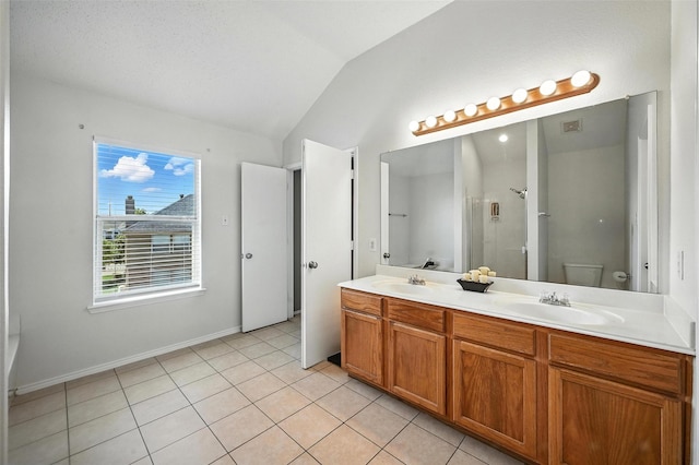 1906 Walnut Hills Ln, Mansfield, TX 76063 - bathroom with vaulted ceiling, double vanity, tile patterned flooring, and a shower