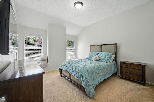 1906 Walnut Hills Ln, Mansfield, TX 76063 - bedroom with carpet flooring, multiple windows, lofted ceiling, and a textured ceiling