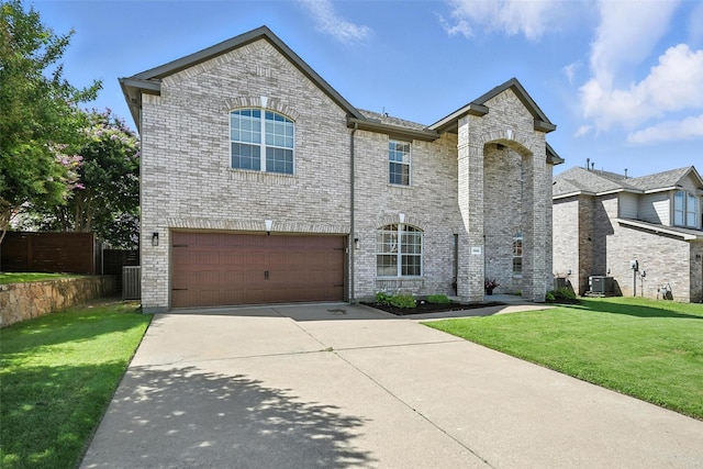 1906 Walnut Hills Ln, Mansfield, TX 76063 - traditional-style home featuring an attached garage, concrete driveway, and brick siding