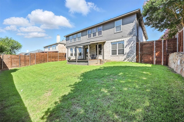 1906 Walnut Hills Ln, Mansfield, TX 76063 - rear view of property with a fenced backyard, brick siding, and a patio area