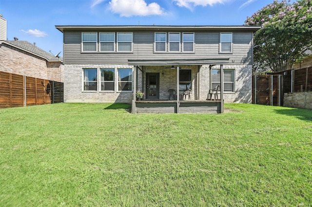 1906 Walnut Hills Ln, Mansfield, TX 76063 - rear view of house with a fenced backyard, brick siding, and a patio