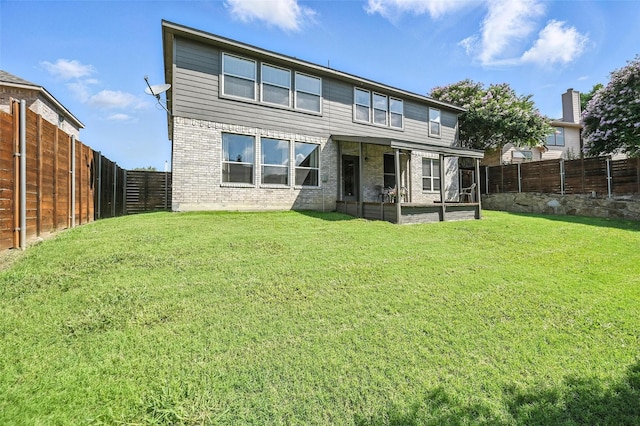 1906 Walnut Hills Ln, Mansfield, TX 76063 - rear view of property featuring brick siding, a fenced backyard, and a sunroom