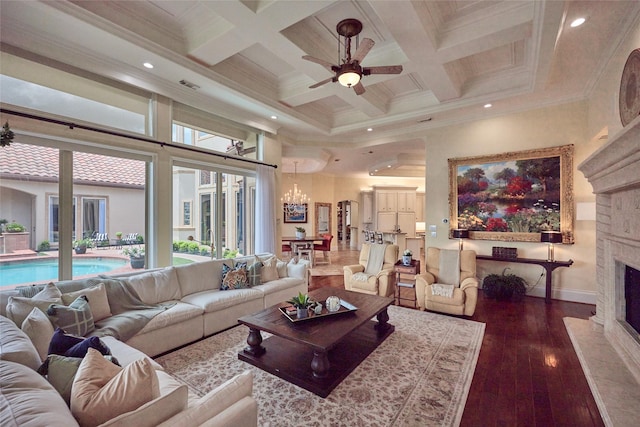 5 Savannah Ridge Dr, Frisco, TX 75034 - living room with a fireplace, a towering ceiling, hardwood / wood-style floors, a chandelier, and a ceiling fan
