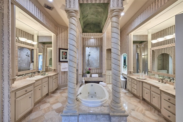5 Savannah Ridge Dr, Frisco, TX 75034 - full bath with two vanities, ornate columns, a whirlpool tub, and wallpapered walls