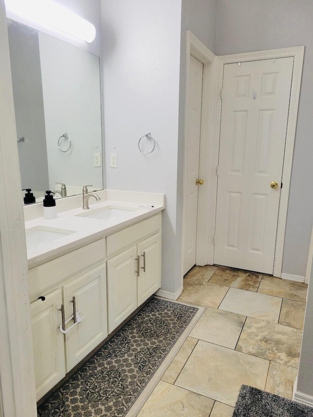 700 Auburndale Dr, Euless, TX 76040 - full bathroom featuring double vanity and baseboards