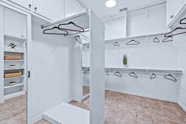 4205 Midpark Ln, Plano, TX 75074 - spacious closet featuring light tile patterned flooring