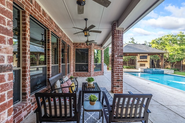 4205 Midpark Ln, Plano, TX 75074 - view of patio / terrace featuring a ceiling fan, a pool with connected hot tub, an outdoor living space with a fireplace, and a gazebo