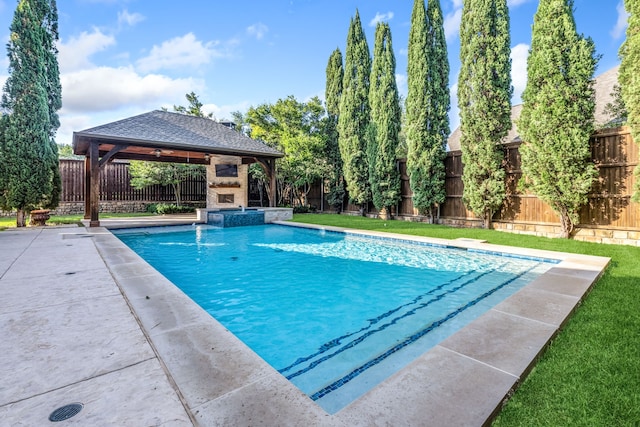 4205 Midpark Ln, Plano, TX 75074 - view of swimming pool with a gazebo, a fenced backyard, a pool with connected hot tub, and an outdoor stone fireplace