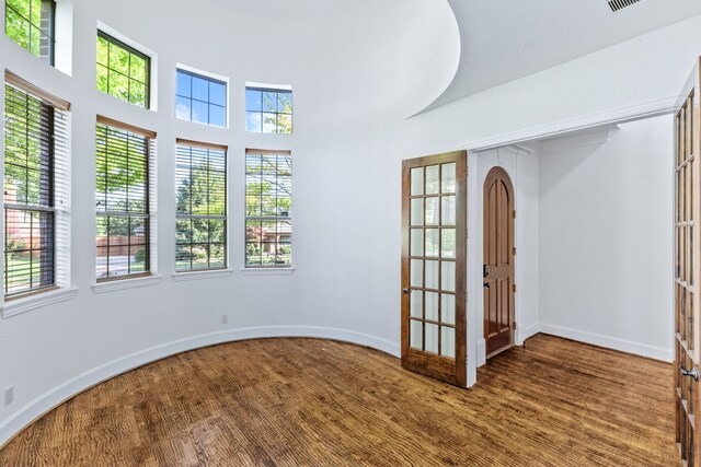 4205 Midpark Ln, Plano, TX 75074 - unfurnished room featuring wood finished floors and a high ceiling