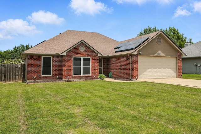 638 Lakeshore Blvd, Oak Point, TX 75068 - view of front of home featuring a garage, solar panels, concrete driveway, brick siding, and roof with shingles