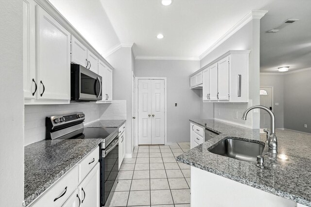 638 Lakeshore Blvd, Oak Point, TX 75068 - kitchen with stainless steel appliances, white cabinetry, crown molding, stone countertops, and backsplash