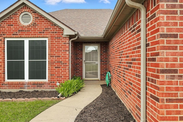 638 Lakeshore Blvd, Oak Point, TX 75068 - view of exterior entry with brick siding and roof with shingles