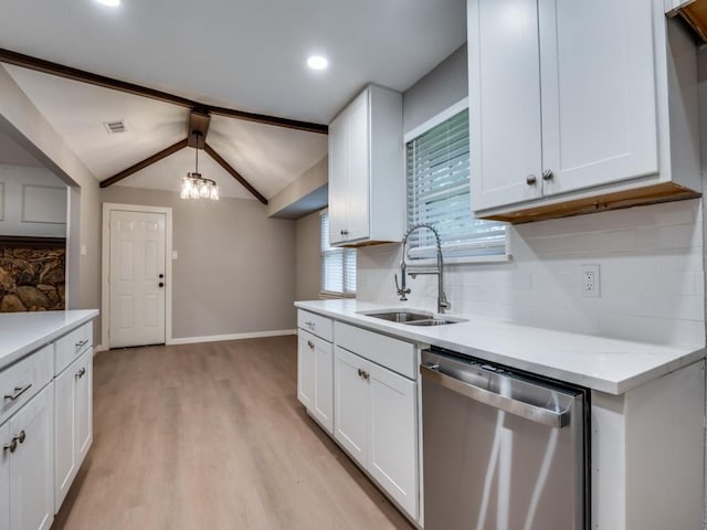 1044 Peach Ln, Desoto, TX 75115 - kitchen featuring stainless steel dishwasher, light wood-style flooring, backsplash, white cabinets, and a chandelier