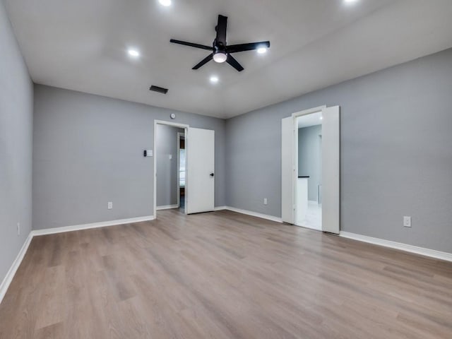 1044 Peach Ln, Desoto, TX 75115 - unfurnished bedroom with wood finished floors, connected bathroom, and recessed lighting