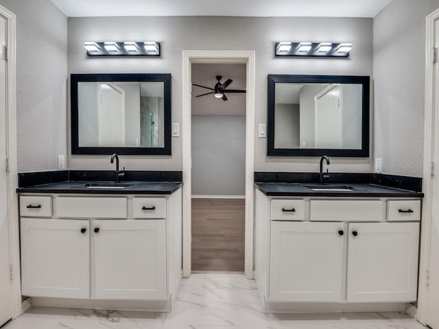 1044 Peach Ln, Desoto, TX 75115 - bathroom with marble finish flooring, two vanities, and a ceiling fan
