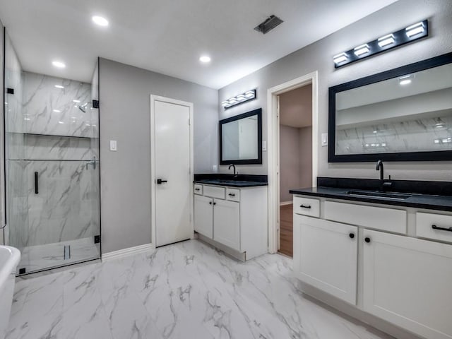 1044 Peach Ln, Desoto, TX 75115 - bathroom featuring a marble finish shower, marble look tile flooring, two vanities, and recessed lighting