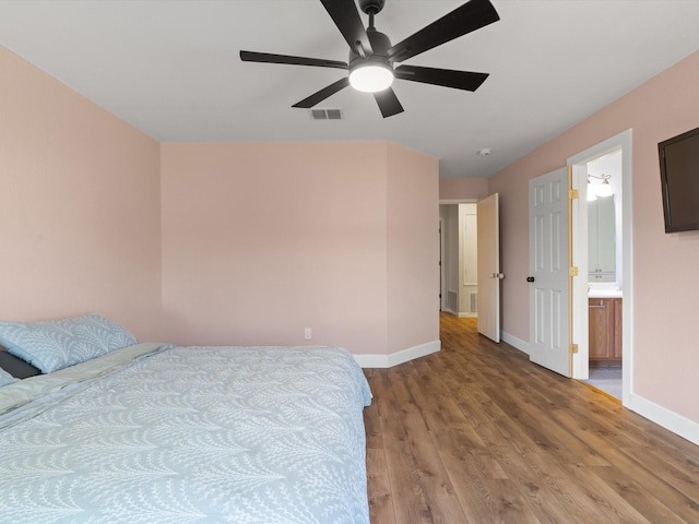 1545 Knottingham Dr, Little Elm, TX 75068 - bedroom featuring light wood finished floors, ensuite bath, and ceiling fan