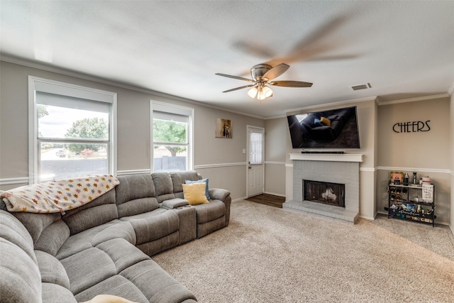 8426 Jacaranda Way, Arlington, TX 76002 - carpeted living area featuring ornamental molding, a fireplace, and a ceiling fan