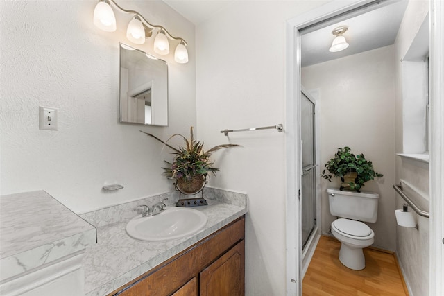 1238 Caladium Dr, Mesquite, TX 75149 - bathroom with vanity, a stall shower, and wood finished floors