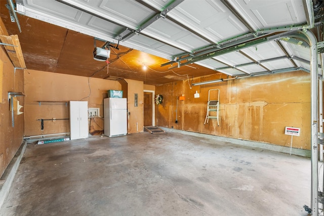 1238 Caladium Dr, Mesquite, TX 75149 - garage featuring freestanding refrigerator and a garage door opener