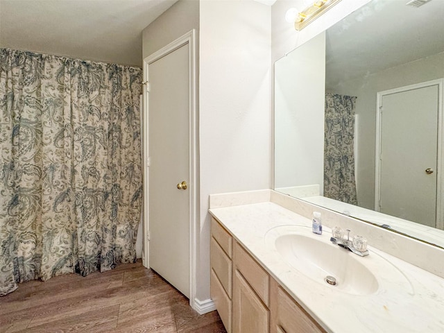 614 Torero Dr, Oak Point, TX 75068 - bathroom with vanity, wood finished floors, and a shower with shower curtain