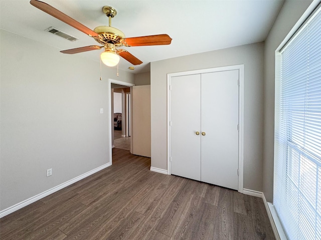 614 Torero Dr, Oak Point, TX 75068 - unfurnished bedroom with wood finished floors, a closet, and a ceiling fan
