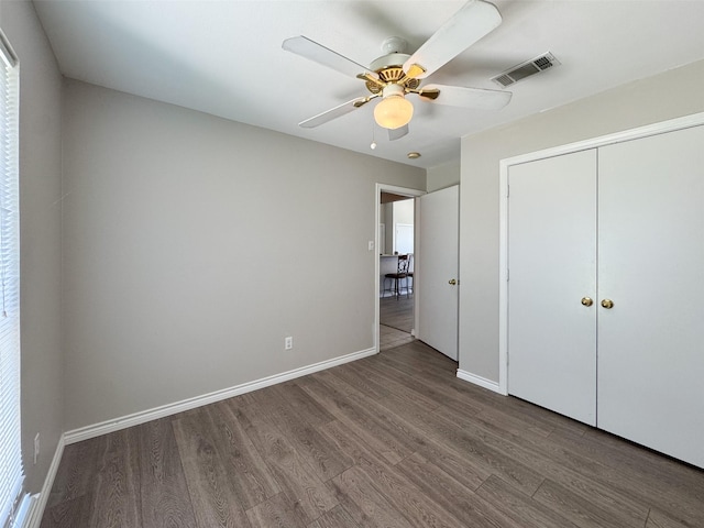 614 Torero Dr, Oak Point, TX 75068 - unfurnished bedroom featuring wood finished floors, a closet, and a ceiling fan