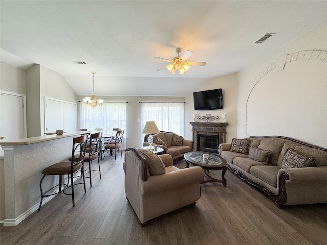 614 Torero Dr, Oak Point, TX 75068 - living area with lofted ceiling, a fireplace, wood finished floors, ceiling fan, and a chandelier