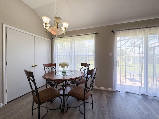 614 Torero Dr, Oak Point, TX 75068 - dining room with a chandelier, wood finished floors, and lofted ceiling