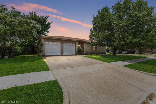 4900 Highbank Dr, Arlington, TX 76018 - view of front facade featuring a lawn, concrete driveway, and a garage