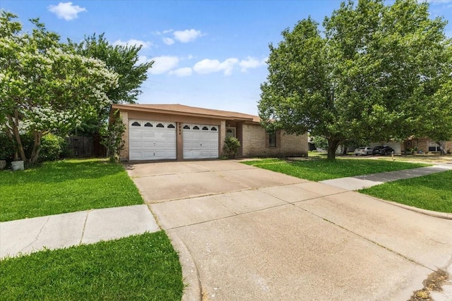 4900 Highbank Dr, Arlington, TX 76018 - view of front of home featuring driveway, an attached garage, a front yard, and brick siding
