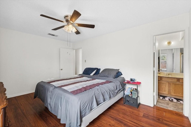 4900 Highbank Dr, Arlington, TX 76018 - bedroom with wood finished floors, ceiling fan, and ensuite bathroom