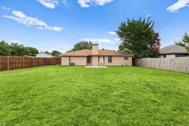 4900 Highbank Dr, Arlington, TX 76018 - back of property with a fenced backyard, a patio, and a chimney