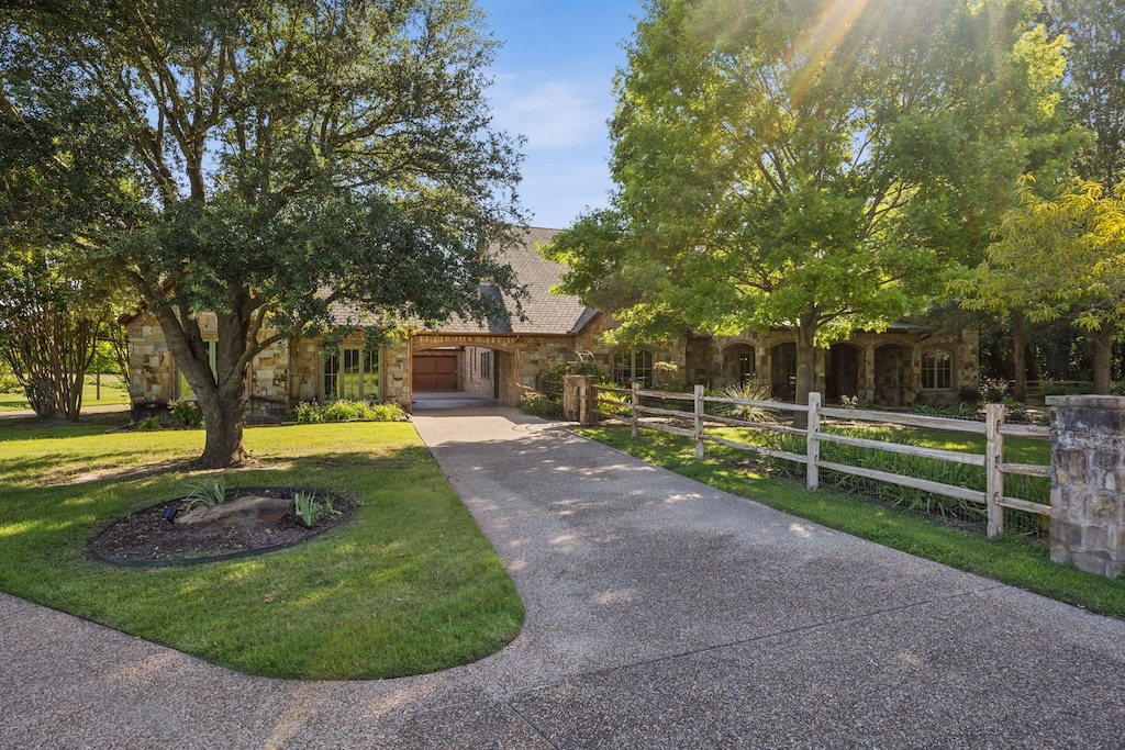 4377 Annetta Centerpoint Rd, Aledo, TX 76008 - obstructed view of property with stone siding, concrete driveway, and an attached carport