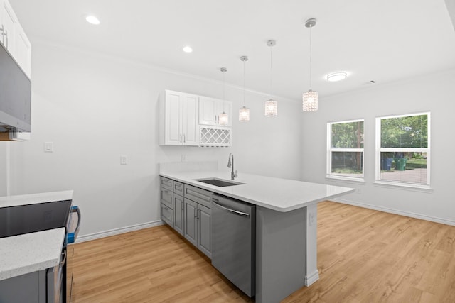301 Henry St, Waxahachie, TX 75165 - kitchen with stainless steel dishwasher, gray cabinets, a peninsula, light wood-type flooring, and range with electric cooktop