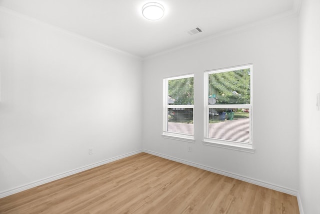 301 Henry St, Waxahachie, TX 75165 - unfurnished room with light wood finished floors and crown molding