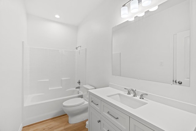 301 Henry St, Waxahachie, TX 75165 - full bathroom with vanity, wood finished floors, and tub / shower combination