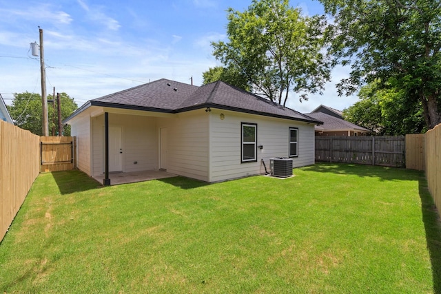 301 Henry St, Waxahachie, TX 75165 - back of property featuring a fenced backyard, roof with shingles, and a patio area