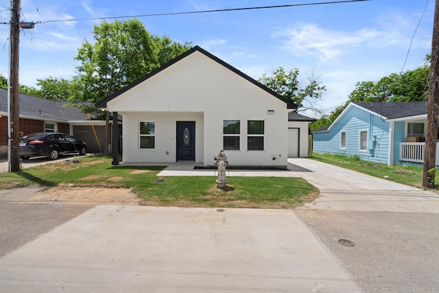 301 Henry St, Waxahachie, TX 75165 - view of front of home featuring brick siding, driveway, and a front lawn